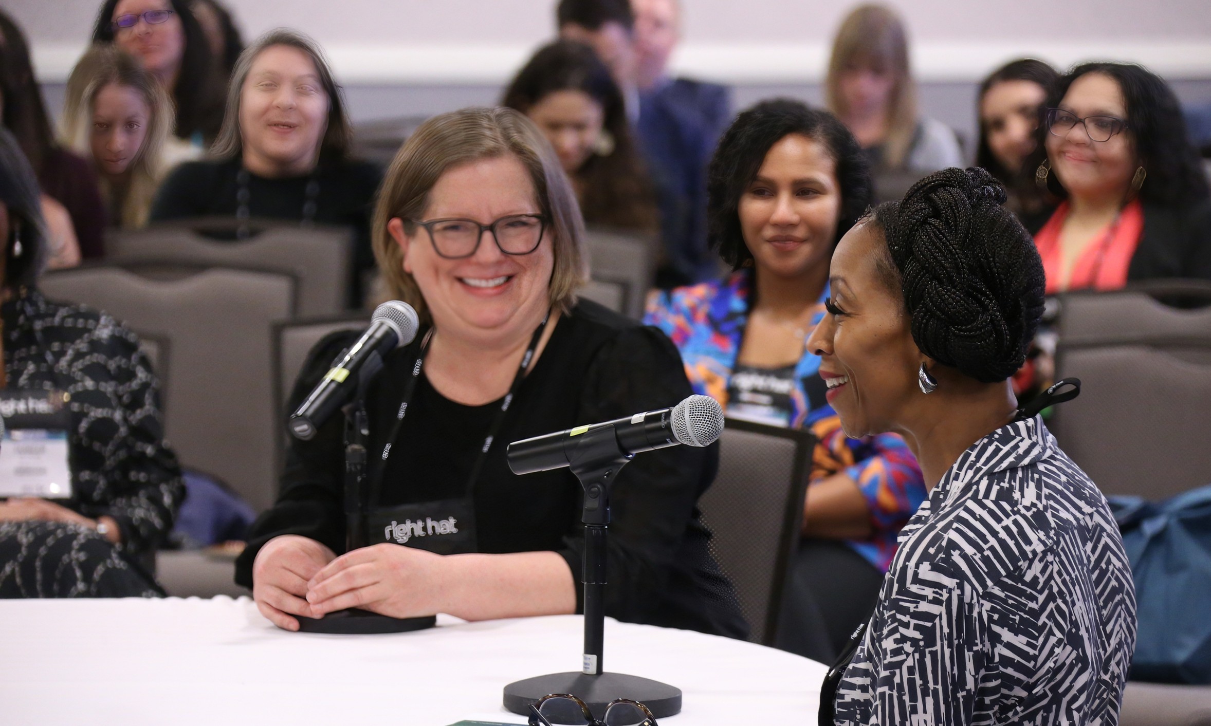 people in audience talking to each other