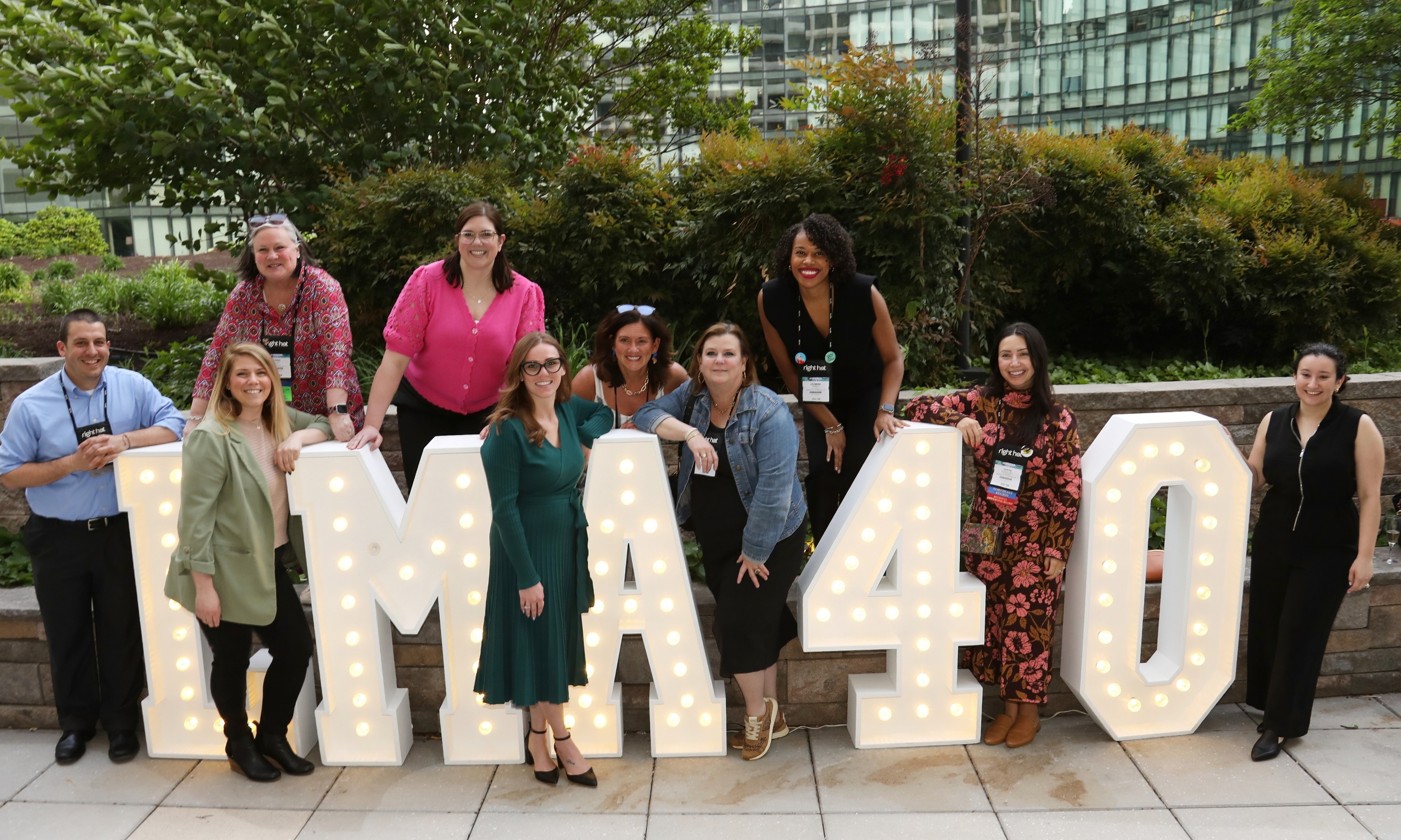 group standing by LMA 40 anniversary sign